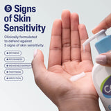 Hand holding a bottle of skincare product with text about skin sensitivity and defense.