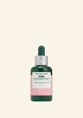 The Body Shop Vitamin E serum bottle on a light green background
