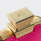 Gold and pink cosmetic product with 'Alessandro' branding on a light gray background