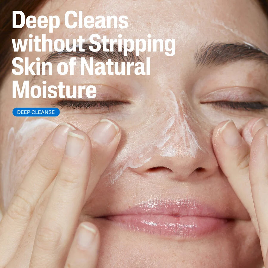 Person applying facial cleanser with text 'Deep Cleans without Stripping Skin of Natural Moisture' on a beige background