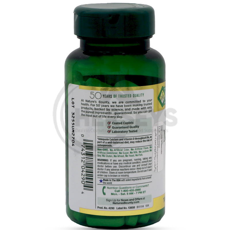 Nature's Bounty Calcium Magnesium Zinc back label showing 50 years quality guarantee, non-GMO, and purity claims.